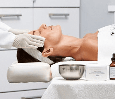 A man getting his face cleaned by two hands.