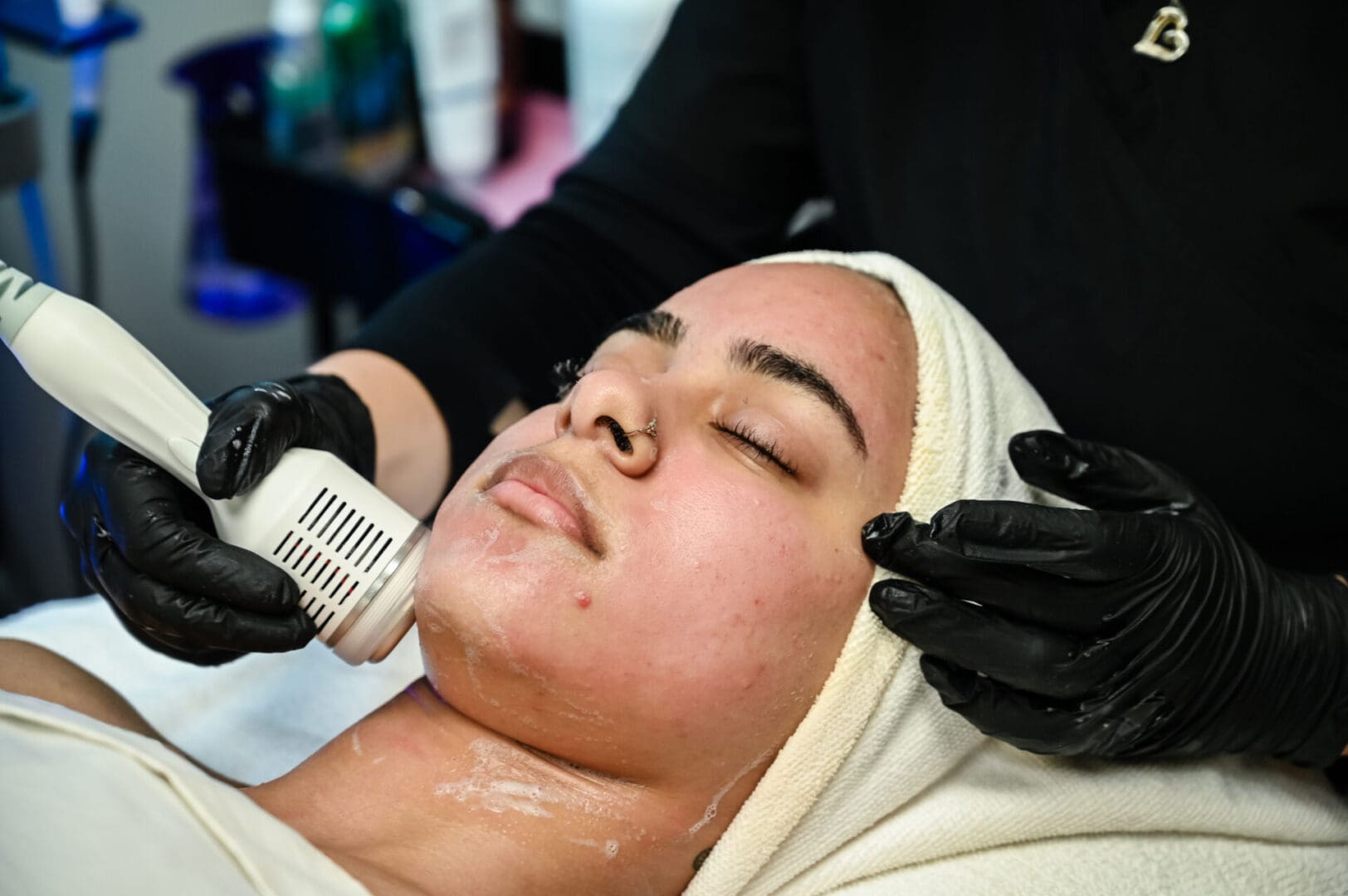 A woman getting her face waxed at the salon