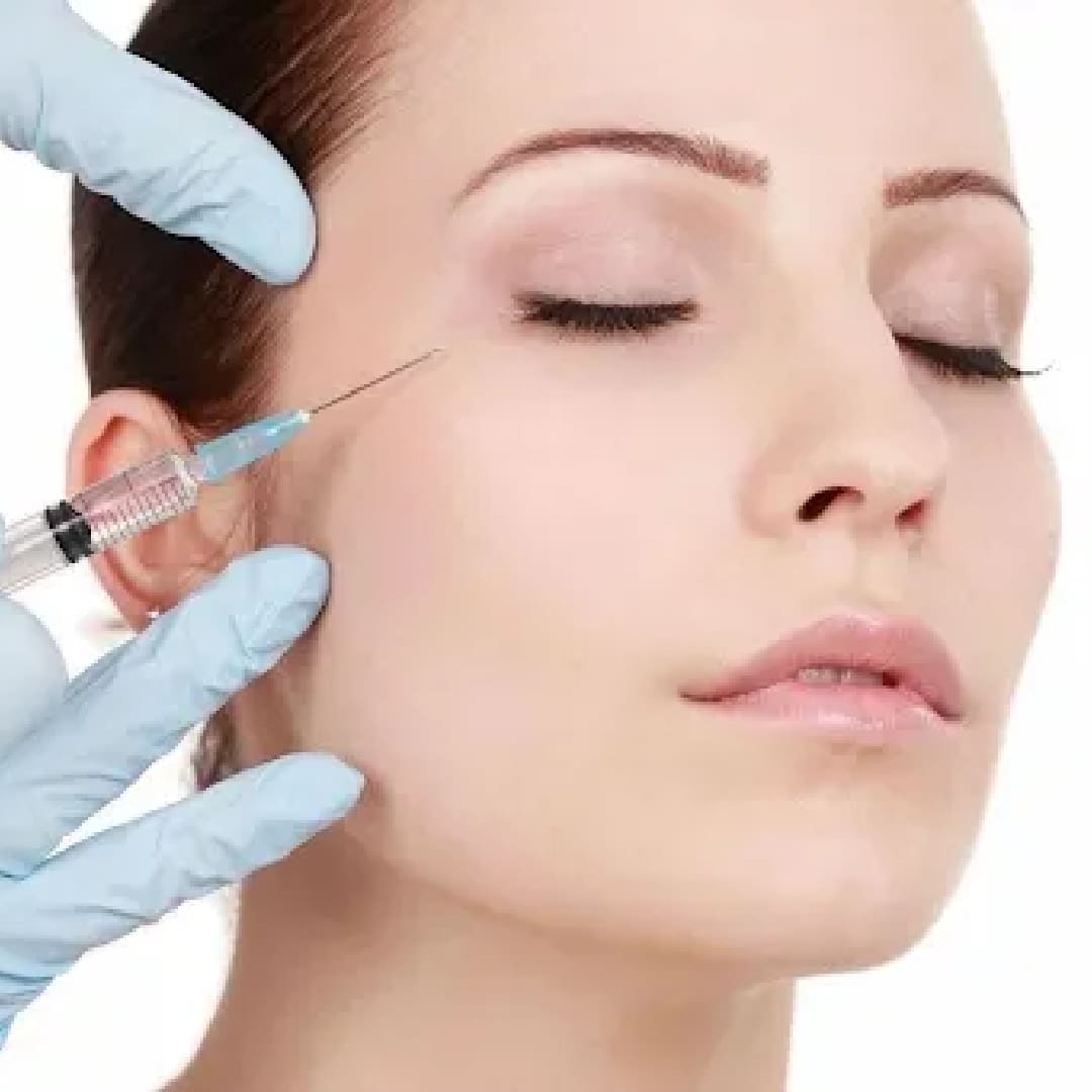 A woman getting an injection in her ear.