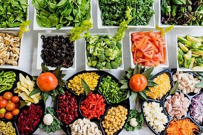 A table filled with lots of different types of food.