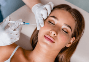 A woman getting an injection in her face.