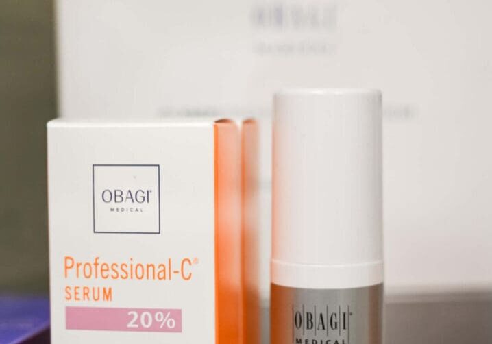 A box of orange cosmetics and a bottle